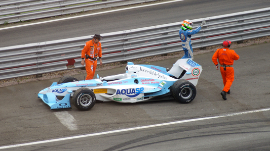 Narain Karthikeyan  exits stage left, Lola Exits stage right